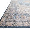 Close-up corner view of Layla rug showing worn vintage texture and dark blue border