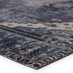 Low angle close-up showing the textured polypropylene weave and blue and gray medallion details.