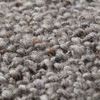 Close-up showing textured wool and cotton weave in ivory and beige tones on pillow surface
