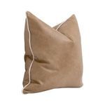 Side angle view showing pillow’s cream-colored piping detail along edges and slightly rounded shape