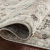 Rug corner folded over revealing backside weave and edge binding on dark wood floor