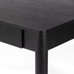 Close-up on rounded desk leg and drawer side detail