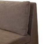 Close-up of attached back cushion detail with visible seams and linen texture