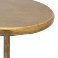 Close-up of round tabletop edge and part of stem showing textured gold finish