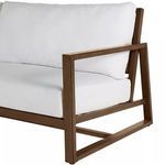 Close-up of brown aluminum frame corner with angled support and white cushions