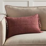 Majere Solid Rose Pillow styled on beige sofa cushion showcasing size and room context