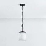 Pendant light shown with interior orb unlit, highlighting the vertical fluting texture