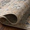 Folded corner of Milena rug emphasizing thickness and dense weave on wooden floor.