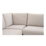Close-up on corner seat cushions and fabric texture of slipcovered dining banquette