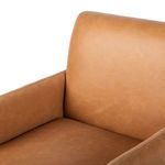 Close-up showing smooth seat surface and plush backrest inside leather armchair