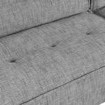 Close-up of front seat cushion showing tufting and smooth fabric weave