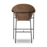 Back view showing full woven panel and iron frame legs with footrest