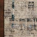 Leigh Granite Slate Rug with beige background, distressed geometric motifs in blue, gray, and brown, textured polyester pile