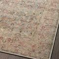 Angled close-up of Adrian Ocean Clay rug showing vintage floral pattern with muted pink, blue, and beige hues
