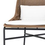 Close-up of chair's front lower frame with woven edge and white seat cushion