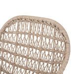 Up-close look at intricate diagonal weave on curved wicker backrest
