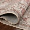 Folded edge close-up revealing underside backing and textured weave of the rug fabric