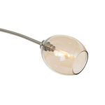 Close-up of larger champagne glass globe revealing filament bulb and polished nickel fixture