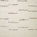 Ivory modern rug with scattered short granite-colored horizontal strokes and stitched edges