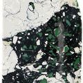Close-up of rounded top edge surface detail on Fossey Object showing green and black decorative speckles