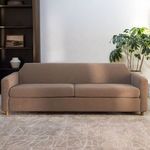 Finch Sofa in natural light with leafy house plant and neutral textured rug beneath