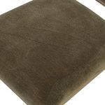 Close-up of velvety green fabric texture on seat cushion of Artie Dining Chair