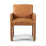 Front view highlighting wide seat and squared armrests of tan leather Amur Dining Armchair