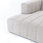 Alternate close-up focusing on the vertical channels of sofa arm and wide seat cushions