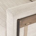 Fabric texture close-up showing woven pattern on taupe sofa upholstery