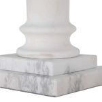 Close-up of the double-tiered square marble base with carved rounded column bottom
