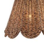 Detailed view of middle and bottom weave pattern of the Kismet rattan shade lit from inside