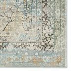 Detailed corner of rug highlighting the ornate border pattern and color gradation