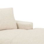 Close-up of right arm and seat cushion seam lines on the sectional’s fabric