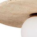 Close crop of travertine disc edge above frosted globe emphasizing stone texture and finish