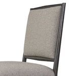 Angled close-up of backrest upholstery curve and side wood frame grain on Glenview Dining Chair