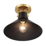 underside view of ceiling light with bulb lit inside black shade