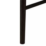 Close-up of carbon-finished scrubbed oak chair leg showing vertical wood grain texture