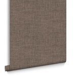 Partial view of Rustic Weft Wallpaper roll standing upright with edges visible