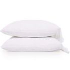 Stacked view of two white cotton percale pillowcases showing ruffled edges and smooth texture.