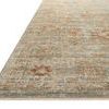 Low-angle close-up showing edge and flat weave texture of Heritage Aqua Terracotta rug