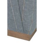 Detail of chair's lower corner showing fabric stripes and sharp wooden base edge