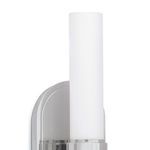 Close-up side view of tall cylindrical opal glass shade and polished metal base