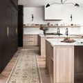 Giada rug as a runner in a modern kitchen with light wood cabinetry and black accents