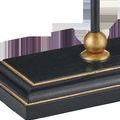 Close-up of rectangular black wooden lamp base with gold trim and spherical gold accent at stem