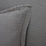 Close-up of textured wavy pebbled fabric and flange detailing on Waverly Duvet Set pillow
