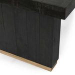 Close-up showing the vertical plank detail of the table leg and natural wood base trim