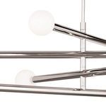 Close-up focusing on the connection between the globe light cover and metal arm with reflective surface