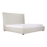 Three-quarter side view of Luzon Tall Headboard Bed with mattress showcasing rounded edges and neutral upholstery