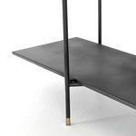 Tight shot of an iron shelf supported by thin frame rods in the Vito bookshelf