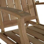 Close-up of curved teak armrest showing wood grain and smooth finish